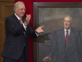 Former prime minister Paul Martin applauds after his official portrait was unveiled during a ceremony on Parliament Hill in Ottawa, Wednesday May 11, 2016.