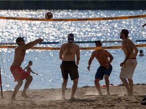 People enjoying some beach volleyball at Mooney's Bay on the long weekend. Sunday May 22, 2016.
