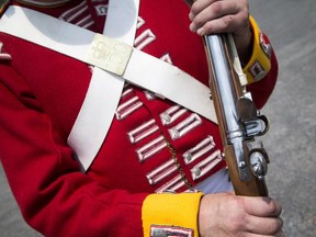 Re-enactors from the 100th Regiment of Foot were demonstrating the steps for firing a 19th century musket at the Canadian War Museum Sunday May 29, 2016.