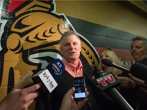 Recently hired Ottawa Senators associate coach Marc Crawford meets with the media outside the dressing rooms at Canadian Tire Centre.