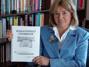 Senator Celine Hervieux-Payette and her book of Inuit recipes.