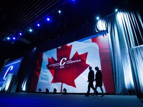 Former prime minister Stephen Harper, left, and his wife Laureen Harper walk on stage for his address to delegates during the 2016 Conservative Party Convention, in Vancouver, B.C. on Thursday May 26, 2016.