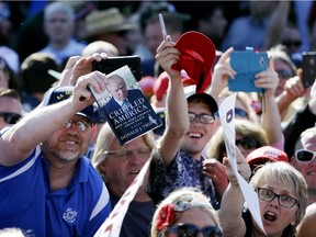 Supporters reach for autographs from Republican presidential candidate Donald Trump after a rally Saturday, May 7, 2016, in Lynden, Wash.