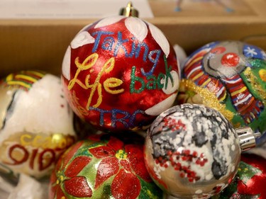 "Taking Life back" reads one of a box of Christmas ornaments Christine recently painted with her right hand, which still has very limited range of motion.