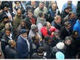 Taxi drivers lined up to get into a community and protective services meeting at Ottawa City Hall on April 7, 2016, when councillors considered a new vehicle-for-hire bylaw. The taxi union is now asking the courts to quash the bylaw.