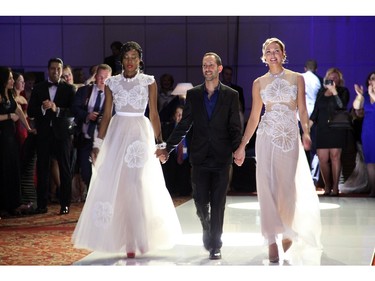 The audience applauds Israeli fashion designer Eyal Zimerman as he walks the catwalk with a pair of models following his fashion show, a featured part of the Loft Gala evening held at the Hilton Lac Leamy on Saturday, April 30, 2016.
