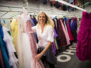Fairy Godmother Ottawa held its annual free prom dress day at Browns Cleaners. Co-Founder Melissa Shabinsky pulls a dress of the rack.