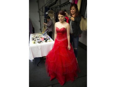 16 year old Tatiana Leavitt lucked out with the help of fairy godmother Mary Ann MacIntosh and found a beautiful red gown and red shoes to match.