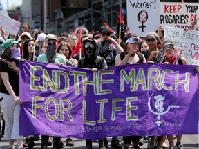 Counter-protesters on scene at the May 2016 March for Life rally in downtown Ottawa. Mayor Jim Watson shouldn't give the annual event the veneer of respectability, write the co-presidents of Planned Parenthood Ottawa. (JULIE OLIVER/POSTMEDIA)