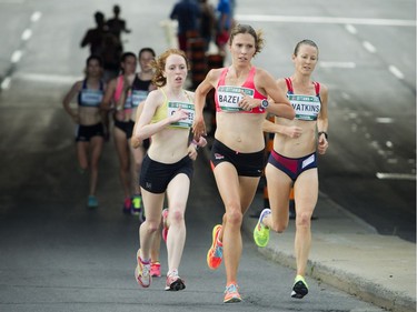 Three women push on during the 10K race.