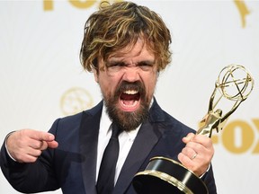 Peter Dinklage, who plays Tyrion Lannister in Game of Thrones, arrives in the Press Room with his award for Best Supporting Actor in a Drama at the 67th Emmy Awards on September 20, 2015 at the Microsoft Theater in Los Angeles, California.