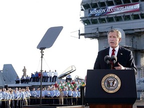 Then-president George W. Bush addresses Americans aboard the nuclear aircraft carrier USS Abraham Lincoln in May, 2003, on the war in Iraq.