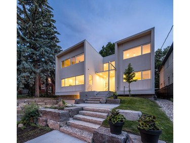 Woo house for homes story by Sheila Brady 

credit doublespace photography

The modern home of glass glows at night.