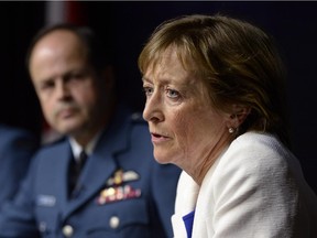 In this file photo, Marie Deschamps, a former Supreme Court justice and author of an inquiry into sexual misconduct in the Canadian Forces, is shown speaking at a news conference in Ottawa on Thursday, April 30, 2015. General Tom Lawson, then the Chief of the Defence Staff, is at left.