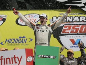 Daniel Suarez yells after winning the NASCAR Xfinity series auto race at Michigan International Speedway, Saturday, June 11, 2016 in Brooklyn, Mich. The was the first win for Suarez. (AP Photo/Carlos Osorio) ORG XMIT: MICO113