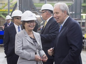 Public Services Minister Judy Foote, left, shares a light moment with Jim Irving, CEO of Irving Shipbuilding, at the Irving Shipbuilding facility in Halifax on Monday, June 13, 2016. The federal government will streamline the process of replacing the navy's aging warships by purchasing an off-the-shelf design as a way to save money and speed up the process. THE CANADIAN PRESS/Andrew Vaughan ORG XMIT: HAL101