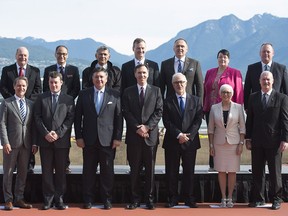 Federal Finance Minister Bill Morneau, centre, is joined by provincial finance ministers during a meeting of finance ministers in Vancouver, Monday, June, 20, 2016.