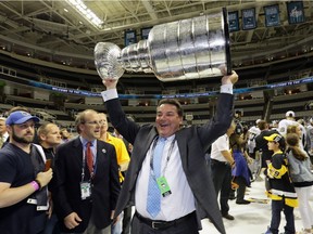 Randy Sexton of the Pittsburgh Penguins celebrates by hoisting the Stanley Cup after his teams 3-1 victory to win the Stanley Cup against the San Jose Sharks in Game Six of the 2016 NHL Stanley Cup Final at SAP Center on June 12, 2016 in San Jose, California. The Pittsburgh Penguins defeat the San Jose Sharks 3-1.