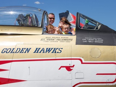 A couple of future recruits as Golden Hawk pilot Eric O'Connor shows off his plane to Loucas, 6, and Dylan Binet.
