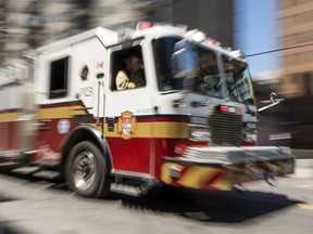 A fire truck zooms along Somerset St. near Bank St. Tuesday February 21, 2016. (Darren Brown. Assignment