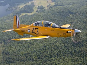 A modern day Harvard flies in the skies over Gatineau. The modern aircraft was painted with the same colour and markings as the vintage aircraft to commemorate the 75th anniversary of the British Commonwealth Air Training Plan.