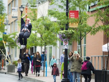 A section of Richmond Road was closed off to traffic for Westboro's new street festival Westboro FUSE Saturday June 11, 2016. Allyson Pinsent flew over Richmond Road along the 300 foot long zipline.   Ashley Fraser
