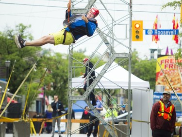 A section of Richmond Road was closed off to traffic for Westboro's new street festival Westboro FUSE Saturday June 11, 2016. James Mead was among those who flew over Richmond Road on the zipline.