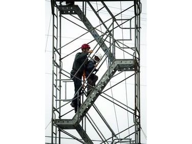 A section of Richmond Road was closed off to traffic for Westboro's new street festival Westboro FUSE Saturday June 11, 2016. A father and son climb up the tower to get to the start of the 300-foot-long zipline above Richmond Road.
