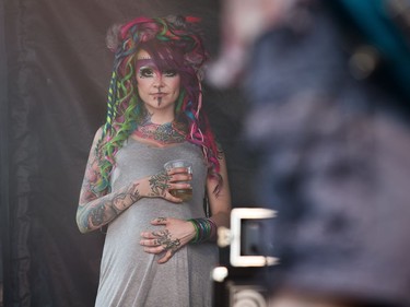 A woman watches the band Demence from backstage as the annual Amnesia Rockfest invades the village of Montebello in Quebec, about an hour away from Ottawa and Montreal.