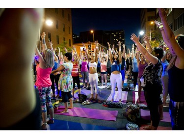 A yoga class on Bank Street during Glowfair Festival Friday June 17, 2016.