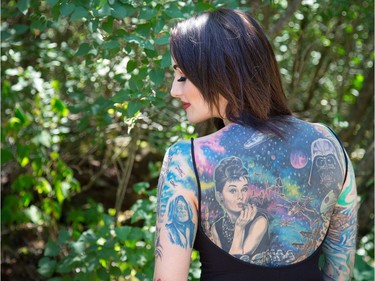 Amy Munro takes a pause from the festival to seek some shade as the annual Amnesia Rockfest invades the village of Montebello in Quebec, about an hour away from Ottawa and Montreal.