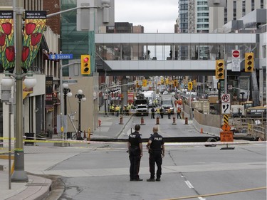 Buildings were evacuated because of a sinkhole just east of the intersection of Rideau Street and Sussex Drive, which caused a gas leak, on June 8, 2016. (David Kawai)