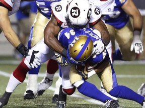 Ottawa Redblacks'Manny Rodriguez tackles Winnipeg Blue Bombers' Carlos Anderson during pre-season CFL football action in Ottawa Monday, June 13, 2016.