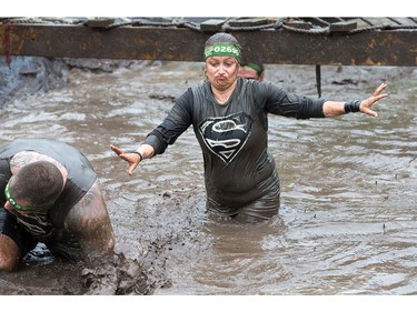 Christine Larose struggles through a mud pit as the Mud Hero Ottawa 2016 continued on Sunday at Commando Paintball located east of Ottawa.
