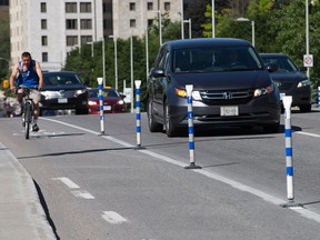 City crews are having to replace flexible sticks used on Laurier Avenue East to keep cars out of the bike lane almost daily because people keep tearing them out.