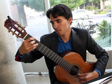 Classical guitarist Daniel Ramjattan provided the lovely background music at the Branching Out Gala held at the home of The Great Canadian Theatre Company, on Thursday, June 23, 2016, to raise funds for the Parkdale Food Centre. (Caroline Phillips / Ottawa Citizen)