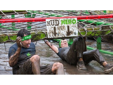 Competitors make their way through an obstacle as the Mud Hero Ottawa 2016 continued on Sunday at Commando Paintball located east of Ottawa.