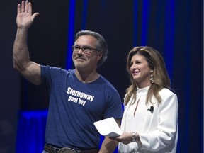 J.P. Veitch, seen here with on of his patented T-shirts, waves with Conservative interim leader Rona Ambrose at the Conservative Party of Canada convention in Vancouver last month.
