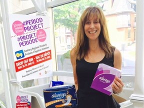 Det. Sylvie Reaney with donated sanitary products.