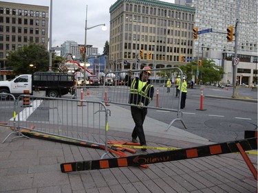 Crews worked into the evening to fill in the sinkhole that opened up this morning just east of the intersection of Rideau Street and Sussex Drive, which caused a gas leak and building evacuations, on June 8, 2016. (David Kawai)