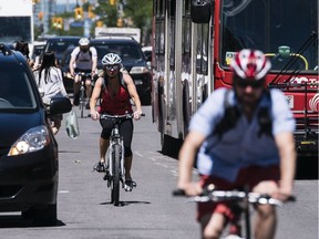 Cyclists make their way South along Bank St. near Somerset St. Tuesday June 21, 2016. As of Sept.1, 2015 vehicles must give cyclists a metre of space. The fine for not giving a metre of room is $180 and two demerit points.