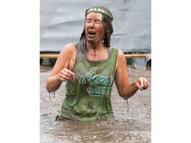Debra Finnimore with a face full of mud as the Mud Hero Ottawa 2016 continued on Sunday at Commando Paintball located east of Ottawa.