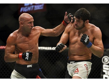 Donald Cerrone, left, fights Patrick Cote in the welterweight co-main event during UFC Fight Night: MacDonald vs. Thompson at TD Place Arena Sunday June 19, 2016. (Darren Brown. Cerrone won with a TKO.