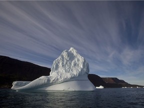 In this July 2011 file photo, an iceberg floats in the sea near Qeqertarsuaq, Disko Island, Greenland.