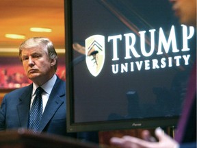 In this May 23, 2005 file photo, real estate mogul and Reality TV star Donald Trump, left, listens as Michael Sexton introduces him at a news conference in New York where he announced the establishment of Trump University.