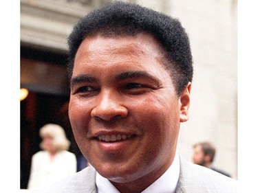 FILE - This is a 1995 file photo showing Muhammad Ali smiling during a visit to New York. Ali, the magnificent heavyweight champion whose fast fists and irrepressible personality transcended sports and captivated the world, has died according to a statement released by his family Friday, June 3, 2016. He was 74.