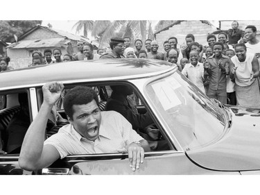 FILE - This is a Sept. 17, 1974  file photo of Muhammad Ali as he chants to fans during  a sightseeing tour downtown Kinshasa, Zaire.  It was 40 years ago that two men met just before dawn on Oct. 30, 1974, to earn $5 million in the Rumble in the Jungle. In one of boxing's most memorable moments, Muhammad Ali stopped the fearsome George Foreman to recapture the heavyweight title in the impoverished African nation of Zaire.