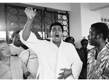 FILE - This is a Thursday, Sept. 12, 1974  file photo of Muhammad Ali, who is due to fight World Champion Georeg Foreman  tells a crowd of boxing fans in N' Sele Zaire,   "Ako bo mai ye,"  which translates from Zaire's Lingalla dialect as: "I will kill him."  Ali's trainer Angelo Dundee is at left,  It was 40 years ago that two men met just before dawn on Oct. 30, 1974, to earn $5 million in the Rumble in the Jungle. In one of boxing's most memorable moments, Muhammad Ali stopped the fearsome George Foreman to recapture the heavyweight title in the impoverished African nation of Zaire.