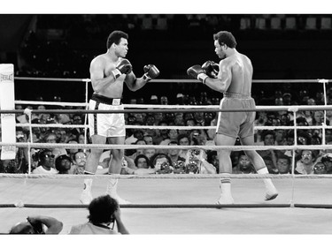 (FILES) This file photo taken on October 30, 1974 shows the fight between US boxing heavyweight champions, Muhammad Ali (L) (born Cassius Clay) and George Foreman in Kinshasa.  Heavyweight boxing legend Muhammad Ali, an icon of the 20th Century whose fame transcended the sport during a remarkable career that spanned three decades, died June 3, 2016, his family said. /