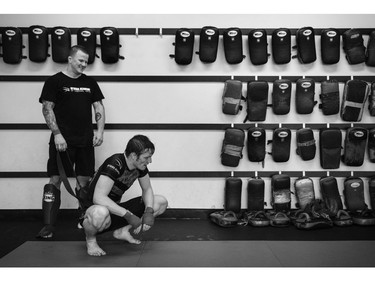 Stonehouse, right, works with Kru Jeff Harrison at the Ottawa Academy of Martial Arts.